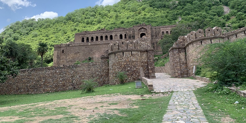 Historic fort ruins symbolising cultural landmarks, a tourist attraction nearby