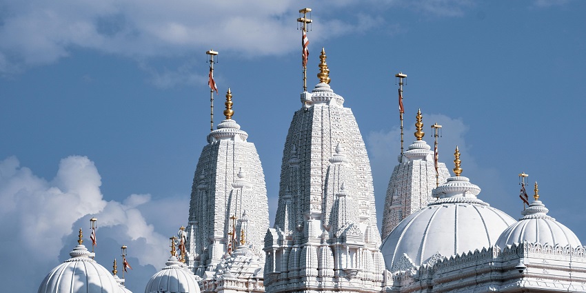 A picture of a famous temple with white exteriors, taken on a sunny day