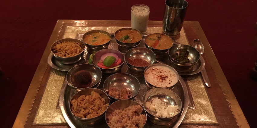 Bapu Bazaar's vibrant stalls serve delicious dal baati churma and refreshing lassi
