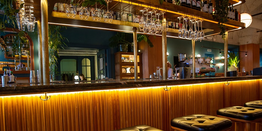 Opulent Italian bar with soft lighting, plush seating, and innovative drinks