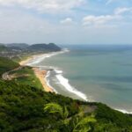 A view of the shimmering waters meeting the pristine golden sands in Andhra Pradesh.