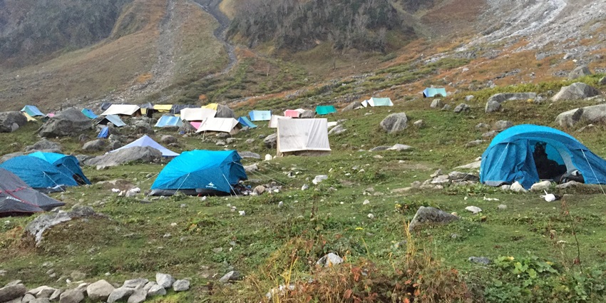 Beas Kund trek, one of the best places for hiking in Manali, lets you stay and explore in tents among deep woods.