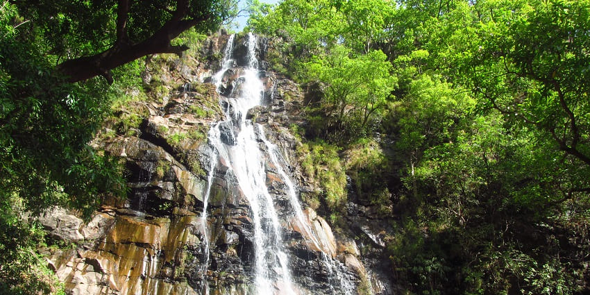 Bee Falls in Pachmarhi, featuring a serene spot where water cascades over rocky terrain