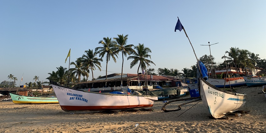 A picture of a beach with boats parked on the shore, one of the best places to visit near Margao