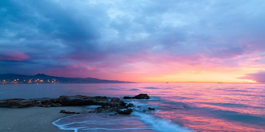 A glimpse of Benaulim Beach featuring a scenic sunset casting its allure on the waters.