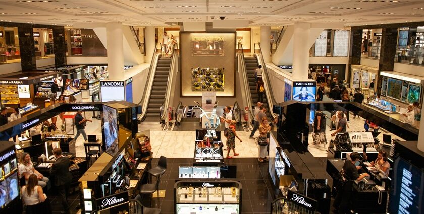 A breathtaking inside view of a shopping complex with a variety of makeup on display.