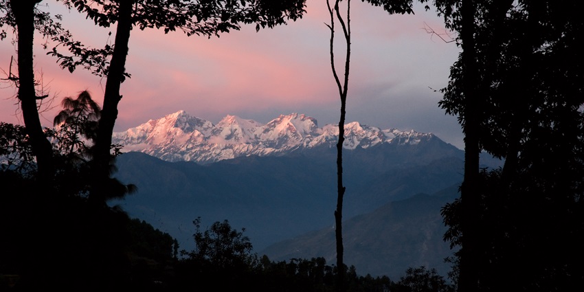 Himalayan Mountains at sunset in Kaule, offering a great experience of skydiving in Nepal.