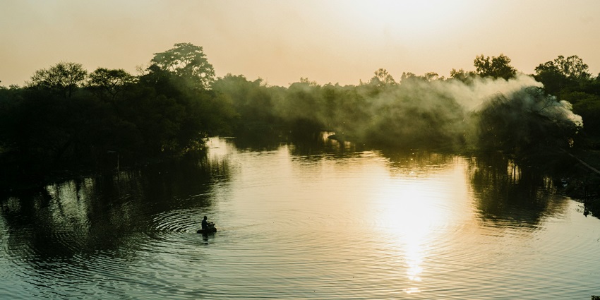 A breathtaking view of a water body surrounded by lush greenery during the daytime.