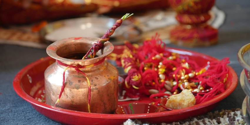 Pooja articles arranged on a traditional thali for Hindu rituals, with vibrant colors
