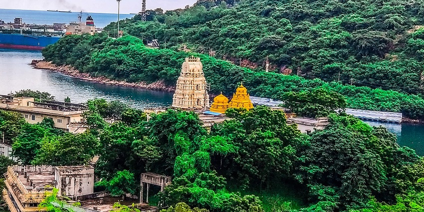 Clear aerial view of the beautiful temple surrounded by the lush green trees and hill