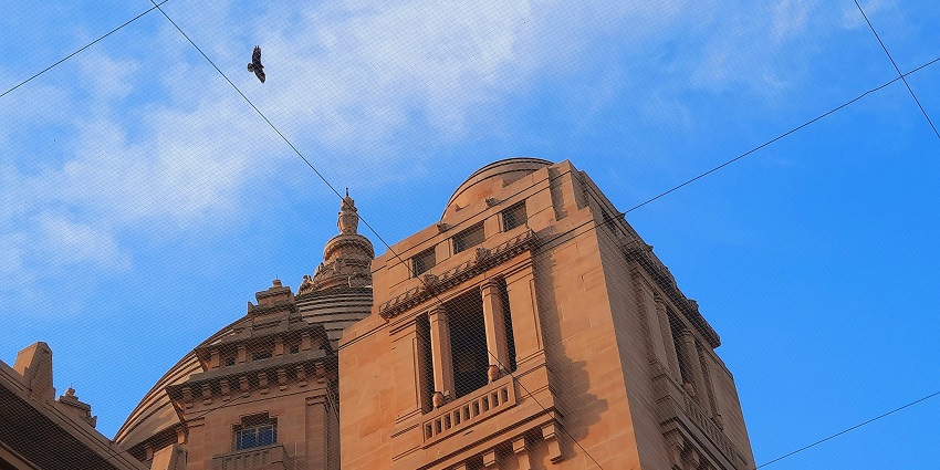 Umaid Bhawan Palace in Jodhpur, India, showcasing its grand architecture during the day.