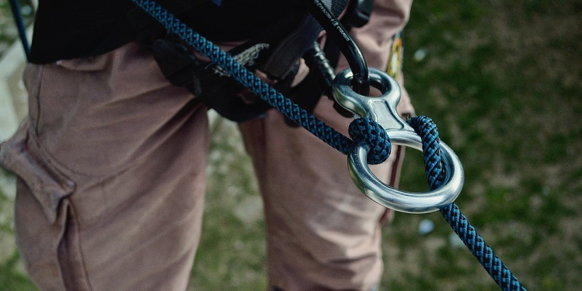 A picture of a person getting ready to experience zip-lining at an adventure park