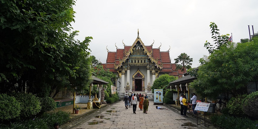 Tergar Monastery surroundings with visitors roaming.