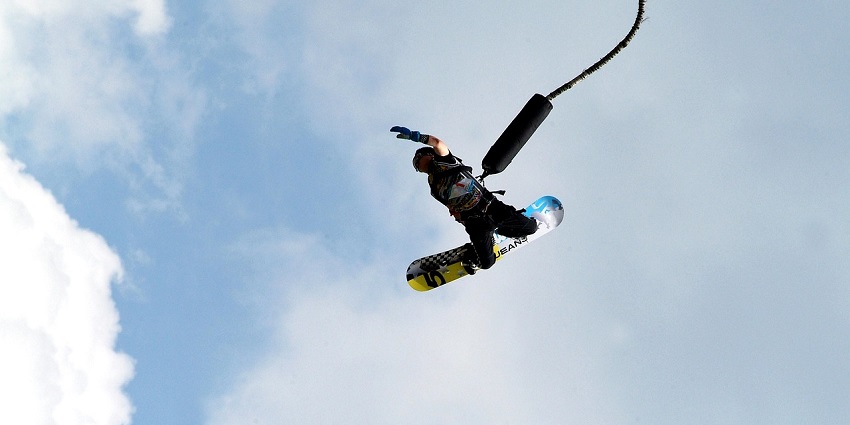Thrilling bungee jumping in Sentosa, capturing the moment of freefall and excitement.