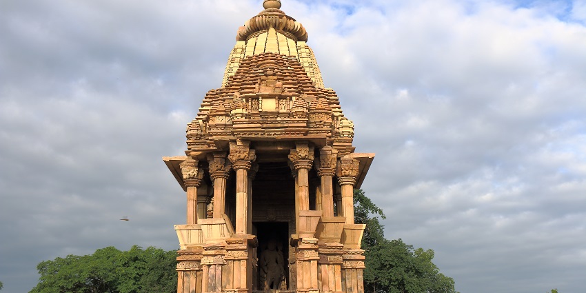 Front view of Chaturbhuj Temple featuring towering spires, intricate stone carvings, and arches.
