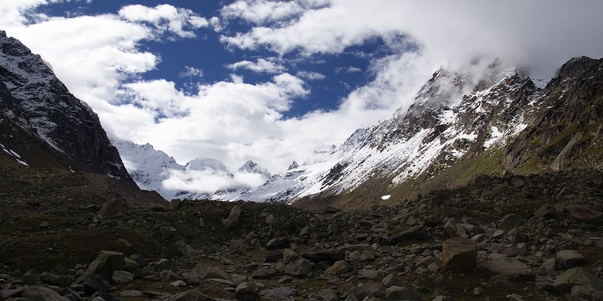 Majestic view of snow covered Himalayan ranges, against the indicolite sky and clouds