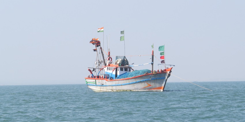 A boat in the middle of the sea of Dwarka with scenic beauty and rich heritage all around