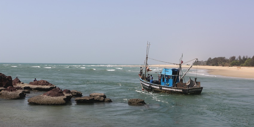 Serene view of people fishing on a boat at the shores of Betul