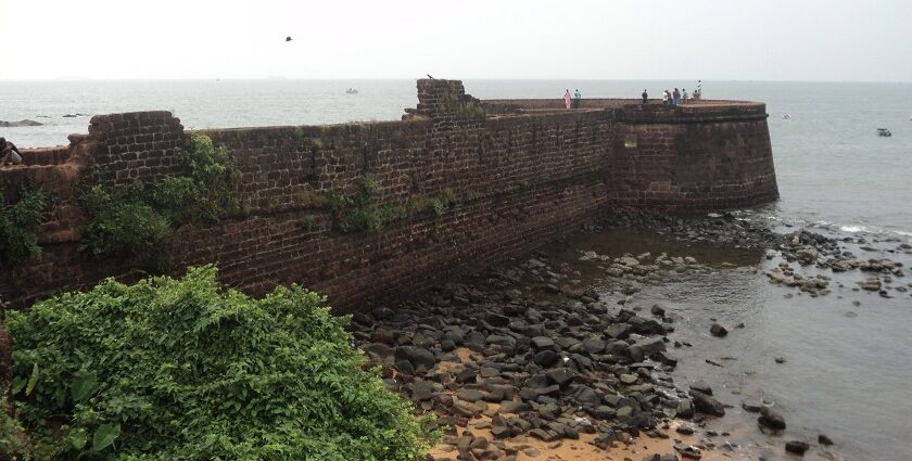 Panoramic view of the walls of Betul fort lining the serene waters at its border