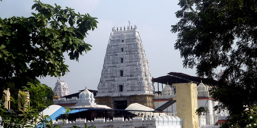Intricate carvings on the gopuram of a temple, an ideal sight for a rejuvenating retreat