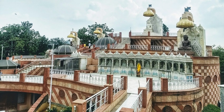 Wide angle view of the Bhadrakali Temple surrounded by lush trees in broad daylight