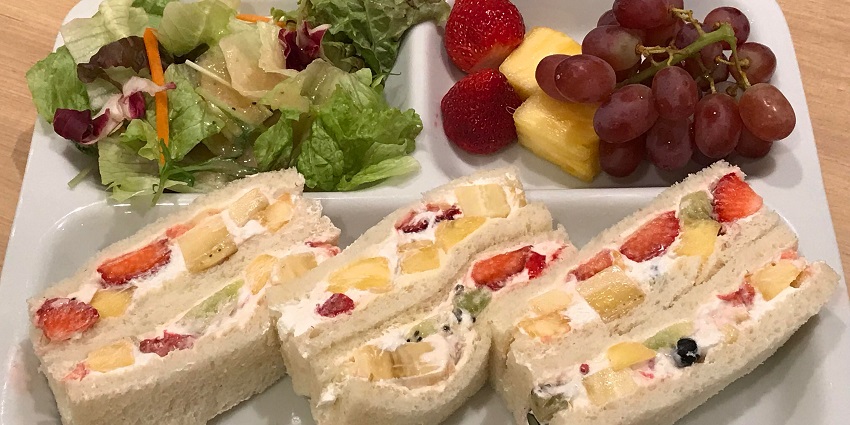 A delicious fruit sandwich from Bhagirath Palace, filled with fresh, colourful fruits and creamy spread