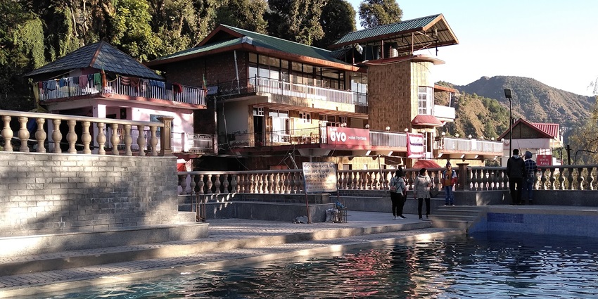 Bhagsu Nag Temple in Himachal Pradesh, nestled amidst lush greenery and stunning hills