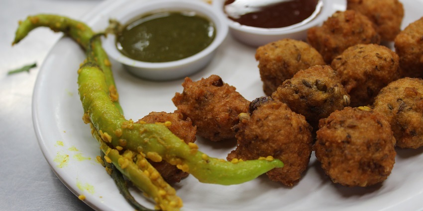 Hot and crispy Bhajiya served with sweet and mint chutney accompanied with green chilli