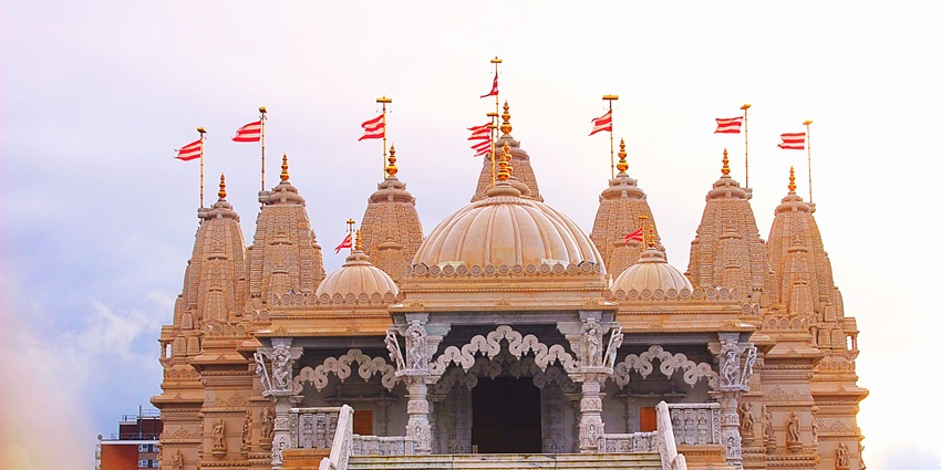 Exterior view of Bhand Devra Temple with stone stairs leading to the entrance.