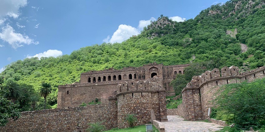 Bhangarh Fort, a haunted site, features ruins in Aravalli hills.