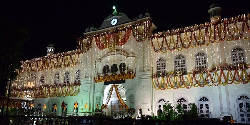A picture of a fort in Punjab taken during nighttime decorated with lights
