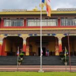 A view of a monastery in Himachal Pradesh with colourful architecture during the day.