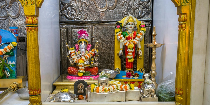 An inside view of the famous Bhima Devi Temple featuring idols of God nestled in Punjab.