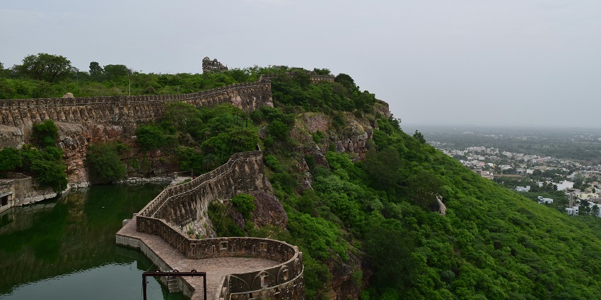 Chikhaldara tourist places feature a serene Bhima Kund water tank surrounded by greenery.