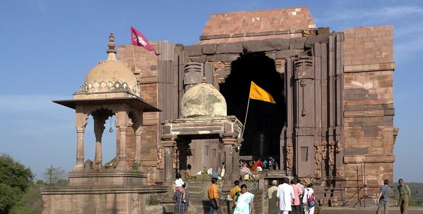 Vibrant entrance filled with bustling devotees and lively energy of pilgrims.