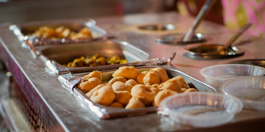 Bhole Mishthan Bhandar serves fresh sweets like jalebi and rasgulla, famous Indian dishes.