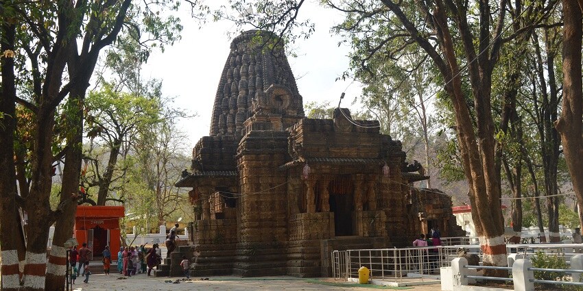 The temple area of Bhoramdeo Temple is half covered in green moss with Nandi’s Statue
