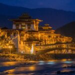 Dzong in Punakha illuminated at night, showcasing the serene Bhutan nightlife.