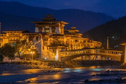 Dzong in Punakha illuminated at night, showcasing the serene Bhutan nightlife.