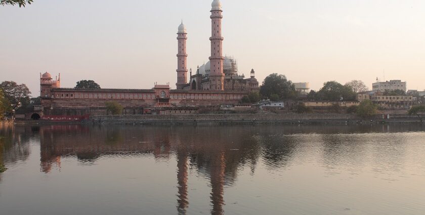 Taj-ul-Masajid , the biggest mosque in India, with its grand domes and minarets, reflected in the adjacent lake