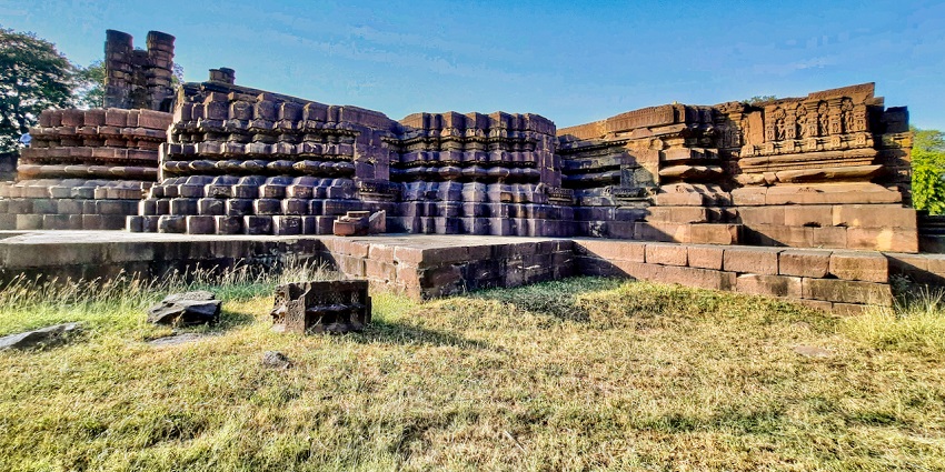 An image view of Bija Mandal in Vidisha, an ancient Shiva temple with intricate carvings, surrounded by lush greenery.