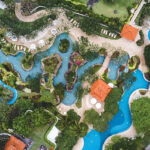 An aerial view of the famous leisure hub in Ajmer surrounded by lush green vegetation.