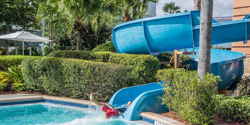 A child enjoying a fun water slide at Birla City Water Park, Jaipur, ideal for family outings.