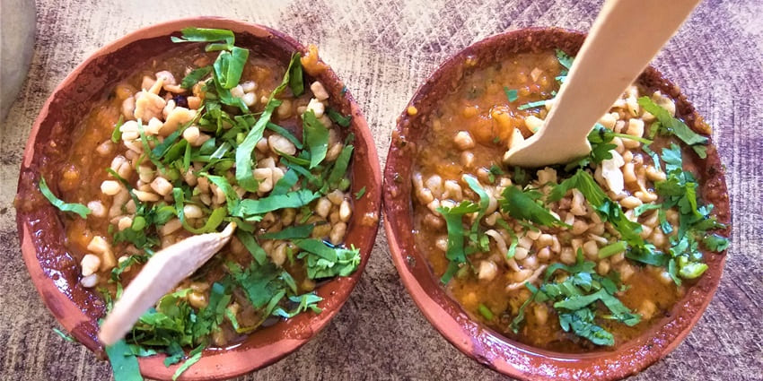 Two bowls of tomato chat garnished with coriander, one of the best snacks for tangy food lovers