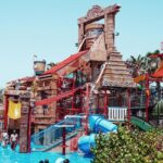 A vibrant Blue Bubble Water Park featuring multiple water rides and thrilling water activities