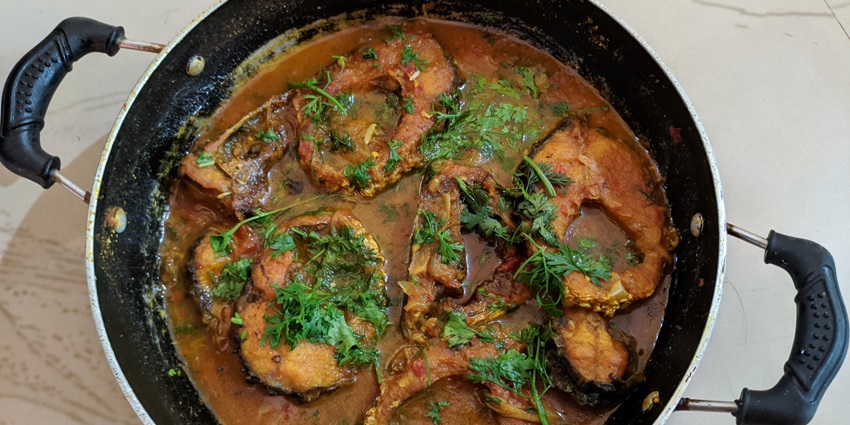 Seafood dishes like fish curry and prawns are served at Blue Sea Restaurant, which has a coastal view
