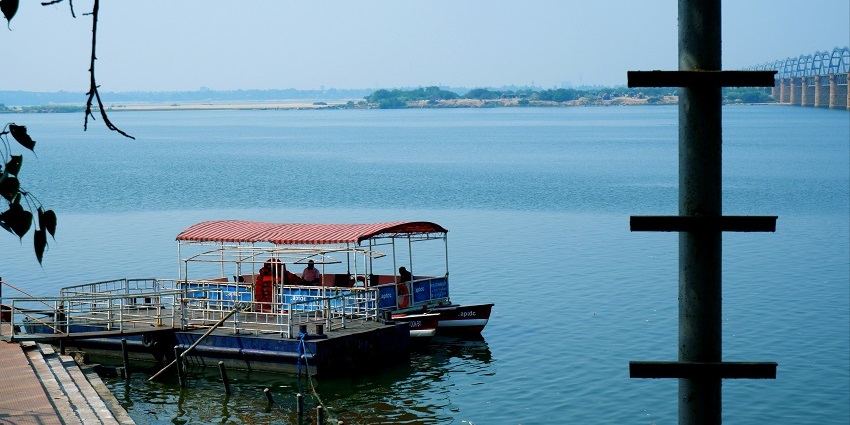 Scenic view of a boat standing still on the serene waters of a river, a fun leisure activity
