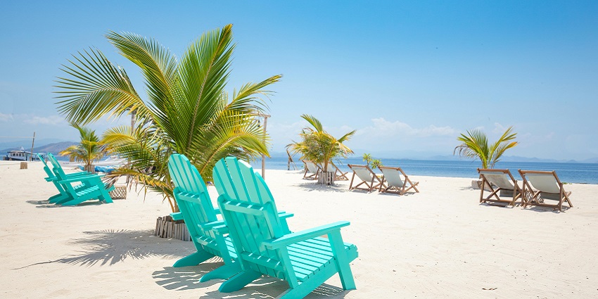A glimpse of the pristine golden sands and turquoise-blue waters of the Bogmalo Beach.