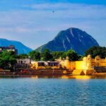 Brahma Temple in Pushkar, surrounded by scenic landscapes and other historic temples.