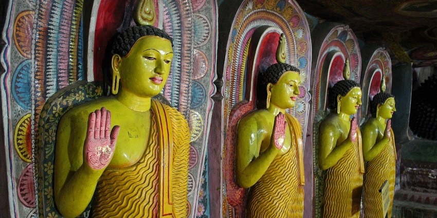 Aluvihara Rock Cave Temple with ancient statues and intricate carvings in Sri Lanka